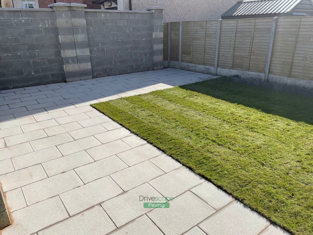 Newgrange Silver Granite Patio with Roll-On Turf in Hansfield Wood