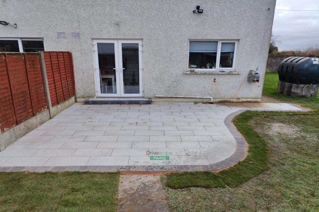 Patio with Newgrange Granite Slabs and Charcoal Border, New Steps and Roll-on Turf in Dublin