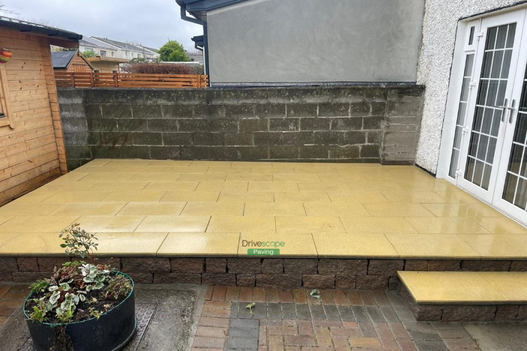 Raised Granite Slabbed Patio with Connemara Walling in Coolock, Dublin