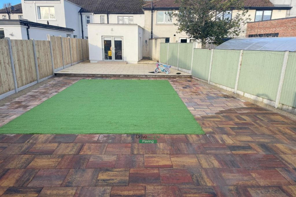 Raised Patio with Buff Granite and Classic Rustic Slabs, New Fencing and Artificial Grass in Clontarf, Dublin